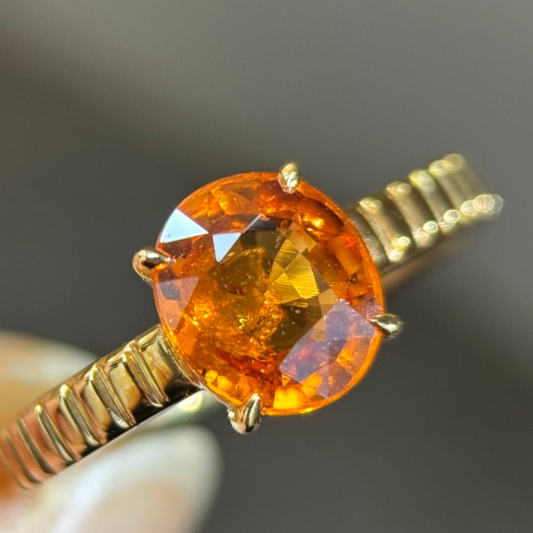 14k Gold 2.01 Ct Natural Spessartine Ring: Ref:231108094 // gold content:14k gold // ring size:7. 25us // // main gemstone:spessartine // shape:oval // carat weight:2. 01ct // color:orange // treatment:natural // Condition: NewLow Estimate: