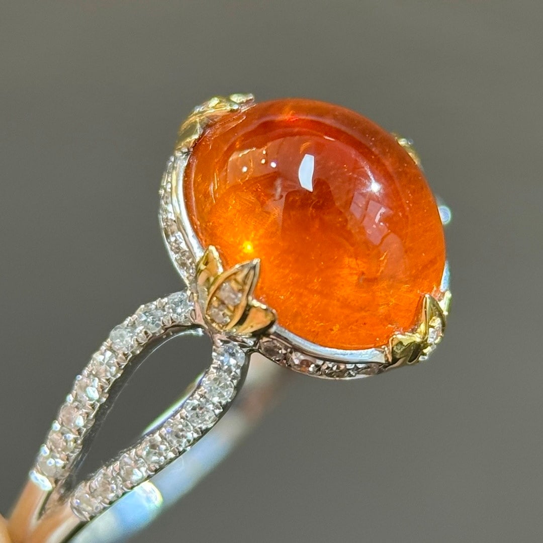 14k Gold 4.66 Ctw Natural Spessartine & Diamond Ring: Ref:231108132 // gold content:14k gold // ring size:7. 25us // // main gemstone:spessartine // shape:oval // carat weight:4. 36ct // color:orange // treatment:natural // // adjacent gemstone 2 : diamo