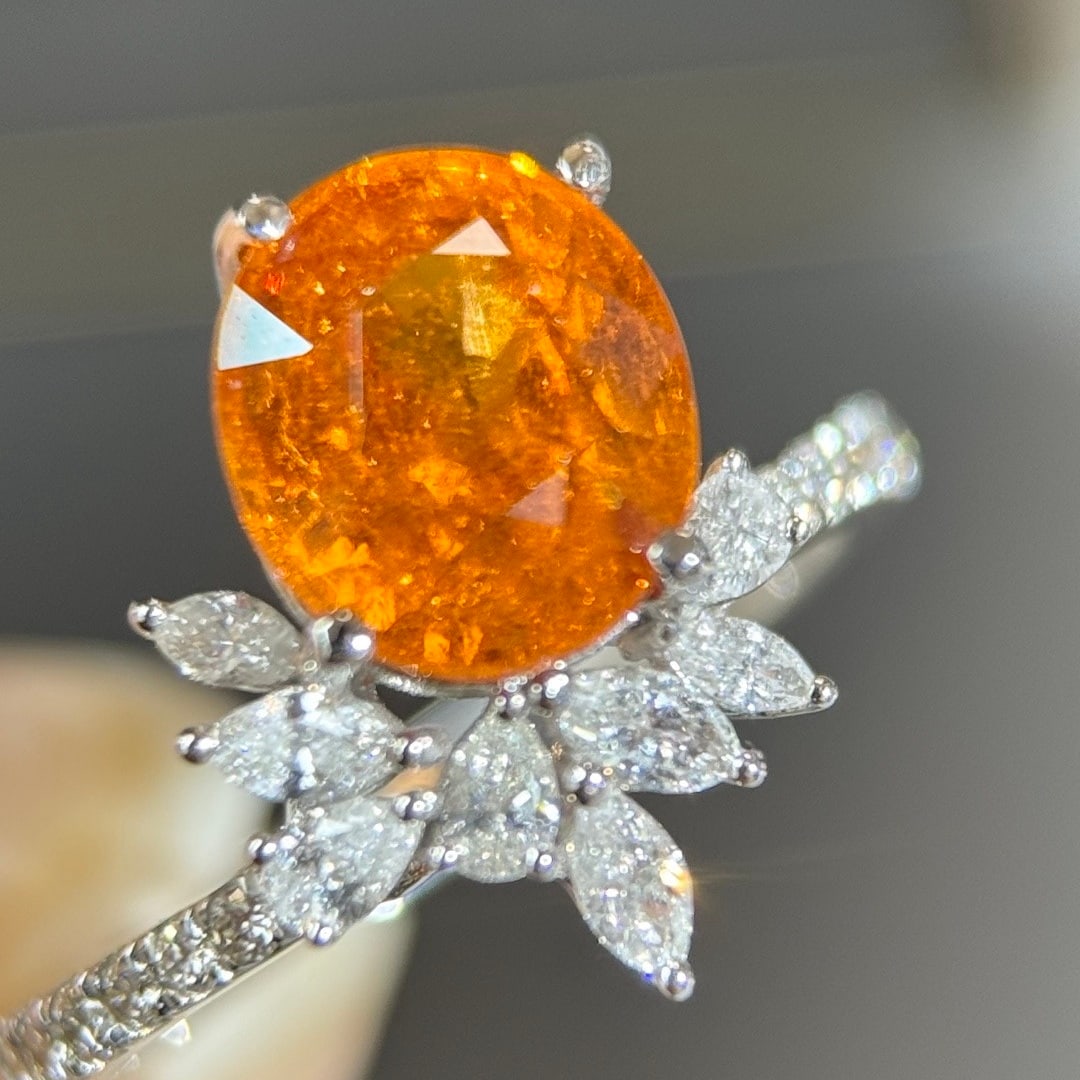 14k Gold 4.16 Ctw Natural Spessartine & Diamond Ring: Ref:231108177 // gold content:14k gold // ring size:7. 25us // // main gemstone:spessartine // shape:oval // carat weight:3. 52ct // color:orange // treatment:natural // // adjacent gemstone 2 :