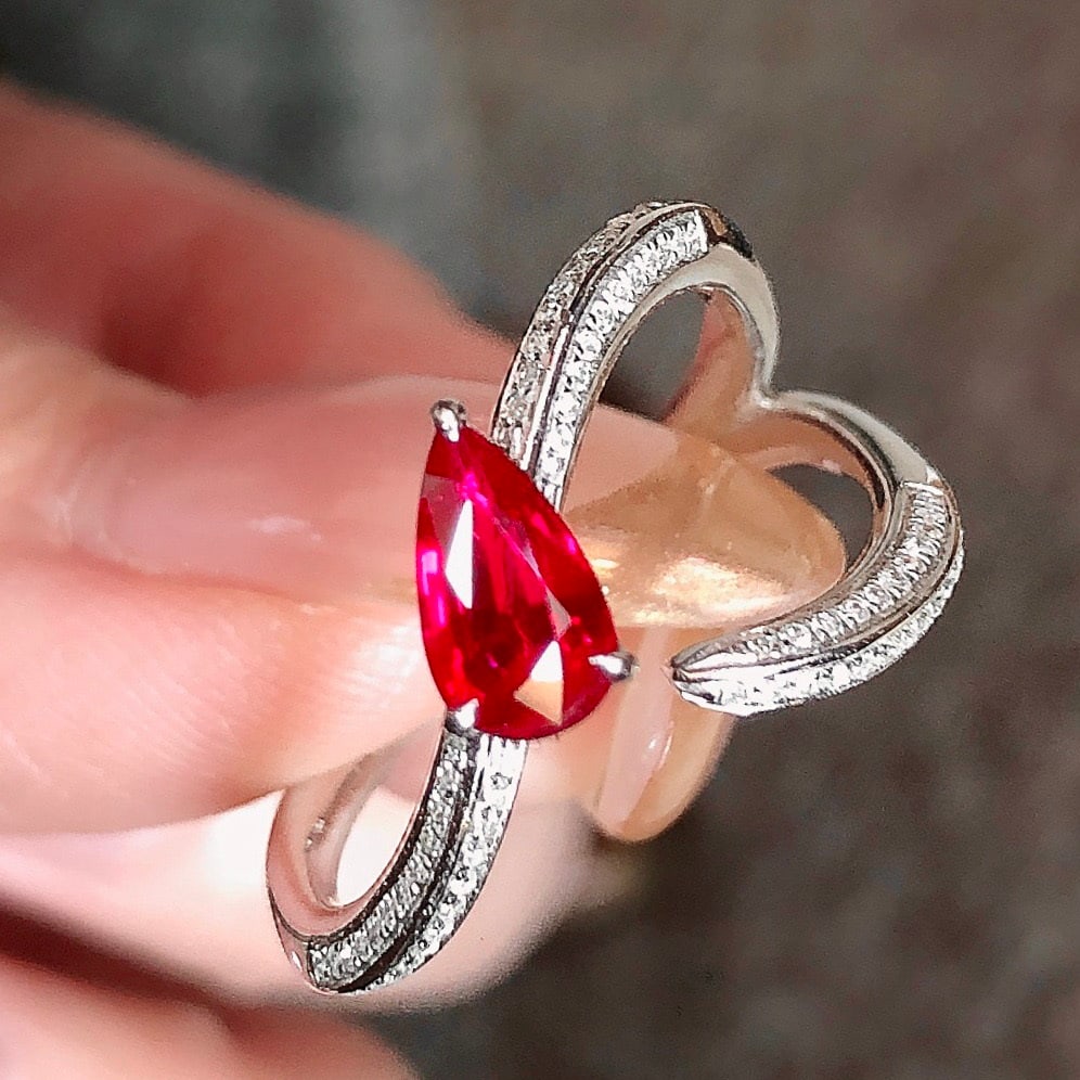 14k Gold 0.76 Ctw Natural Ruby & Diamond Ring: Ref:231110225 // gold content:14k gold // ring size:7. 25us // // main gemstone:ruby // shape:pear // carat weight:0. 62ct // color:pigeonblood red // treatment:natural // // adjacent gemstone 2 :