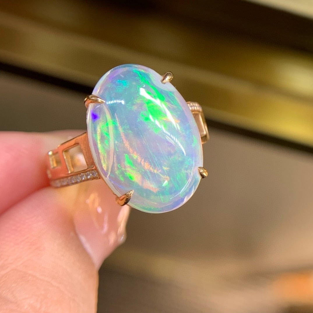 14k Gold 7.1 Ct Natural Opal & Diamond Ring: Ref:231111034 // gold content:14k gold // ring size:7. 25us // // main gemstone:opal // shape:oval // carat weight:7. 1ct // color:color // treatment:natural // // adjacent gemstone 2 : diamond //