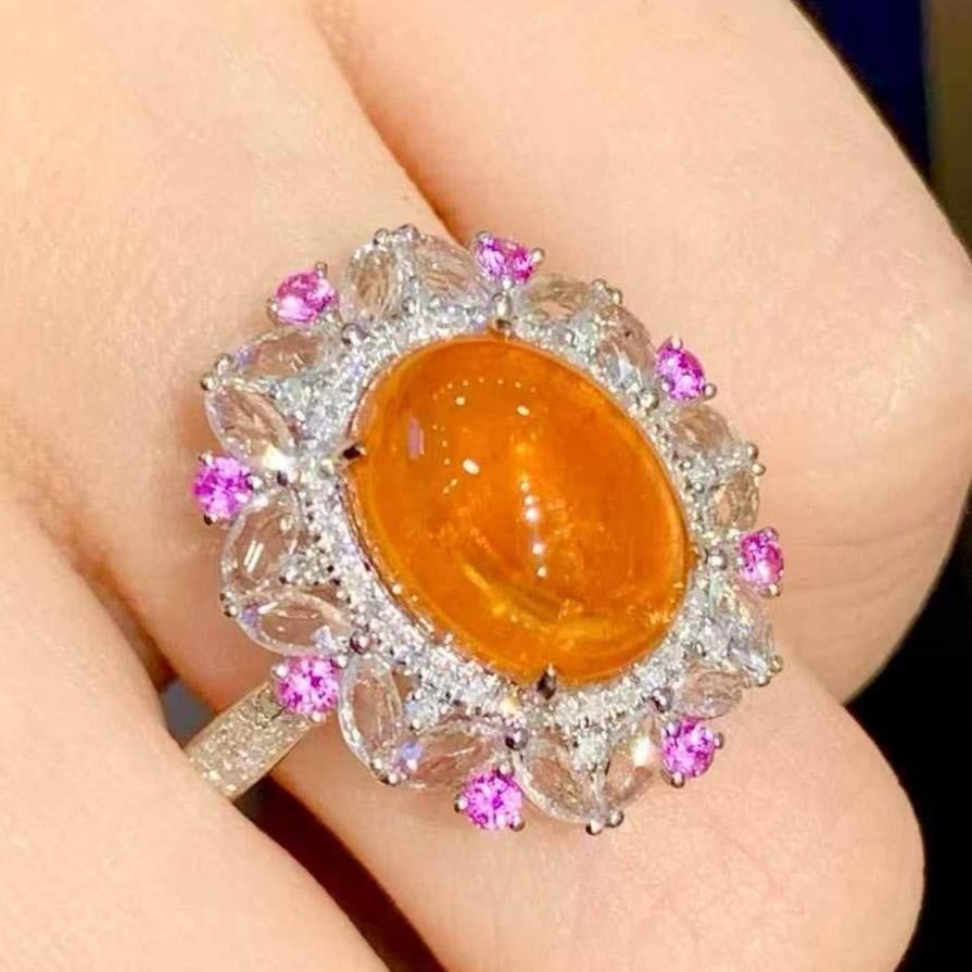 14k Gold 6.35 Ct Natural Spessartine & Diamond Ring: Ref:231111093 // gold content:14k gold // ring size:7. 25us // // main gemstone:spessartine // shape:oval // carat weight:6. 35ct // color:orange // treatment:natural // // adjacent gemstone 2 :
