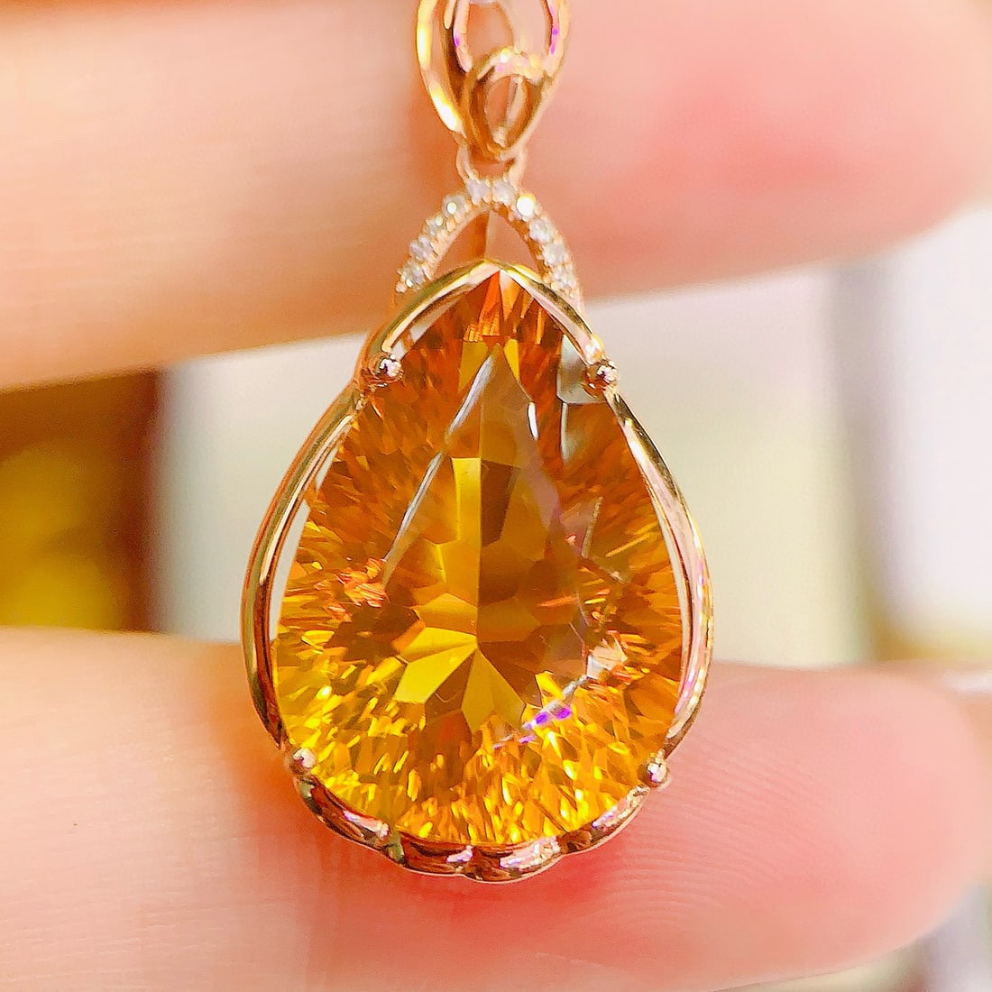 14k Gold 10.73 Ctw Natural Citrine & Diamond Pendant( Without Chain ): Ref:231111103 // gold content:14k gold // main gemstone:citrine // shape:pear // carat weight:10. 7ct // color:yellow // treatment:natural // // adjacent gemstone 2 : diamond // number of stones:10