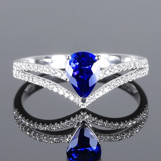 14k Gold 0.92 Ctw Natural Sapphire & Diamond Ring: Ref:231111107 // gold content:14k gold // ring size:7. 25us // // main gemstone:sapphire // shape:pear // carat weight:0. 76ct // color:blue // treatment:natural // // adjacent gemstone 2 :