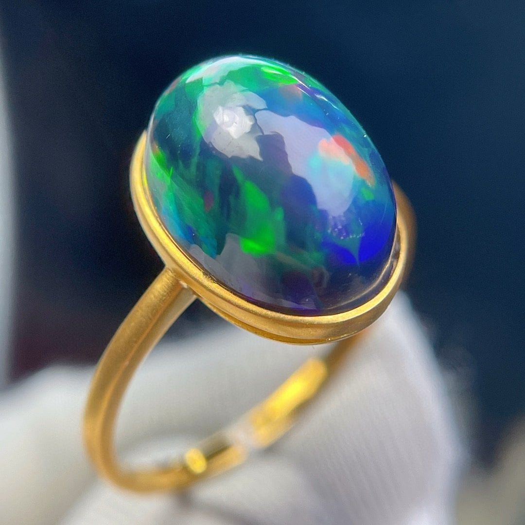 14k Gold 5 Ct Natural Opal Ring: Ref:231111116 // gold content:14k gold // ring size:7. 25us // // main gemstone:opal // shape:oval // carat weight:5ct // color:color // treatment:natural // Condition: NewLow Estimate: 1700High