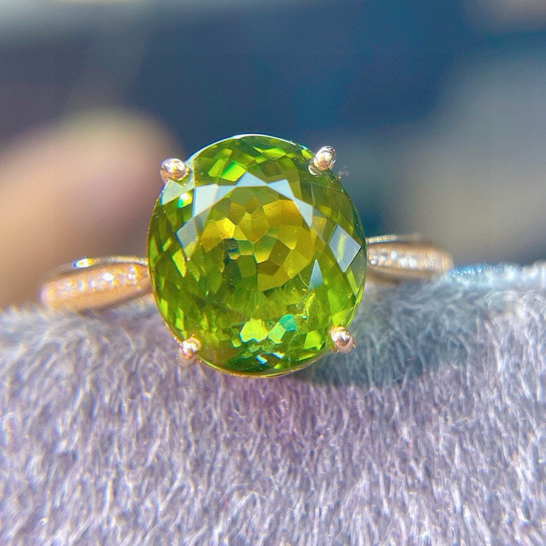 14k Gold 5.75 Ct Natural Tourmaline & Diamond Ring: Ref:231111182 // gold content:14k gold // ring size:7. 25us // // main gemstone:tourmaline // shape:oval // carat weight:5. 75ct // color:green // treatment:natural // // adjacent gemstone 2 :