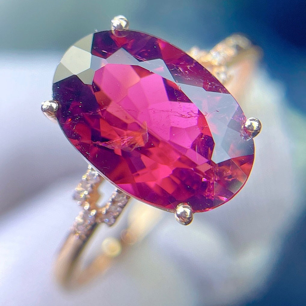 14k Gold 2.6 Ct Natural Tourmaline & Diamond Ring: Ref:231112079 // gold content:14k gold // ring size:7. 25us // // main gemstone:tourmaline // shape:oval // carat weight:2. 6ct // color:red // treatment:natural // // adjacent gemstone 2 :