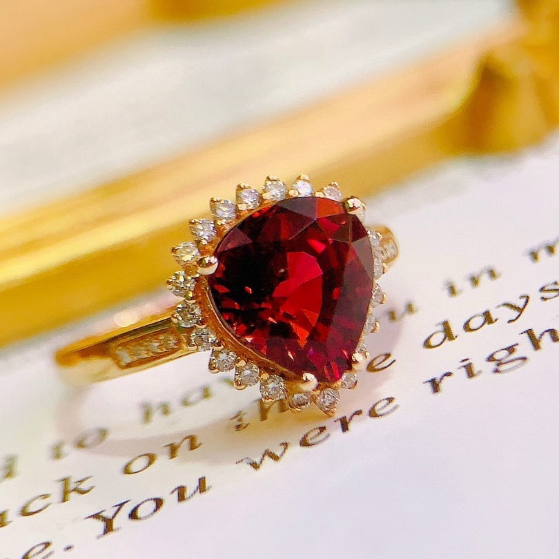 14k Gold 2.8 Ct Natural Tourmaline & Diamond Ring: Ref:231112103 // gold content:14k gold // ring size:7. 25us // // main gemstone:tourmaline // shape:pear // carat weight:2. 8ct // color:red // treatment:natural // // adjacent gemstone 2 :