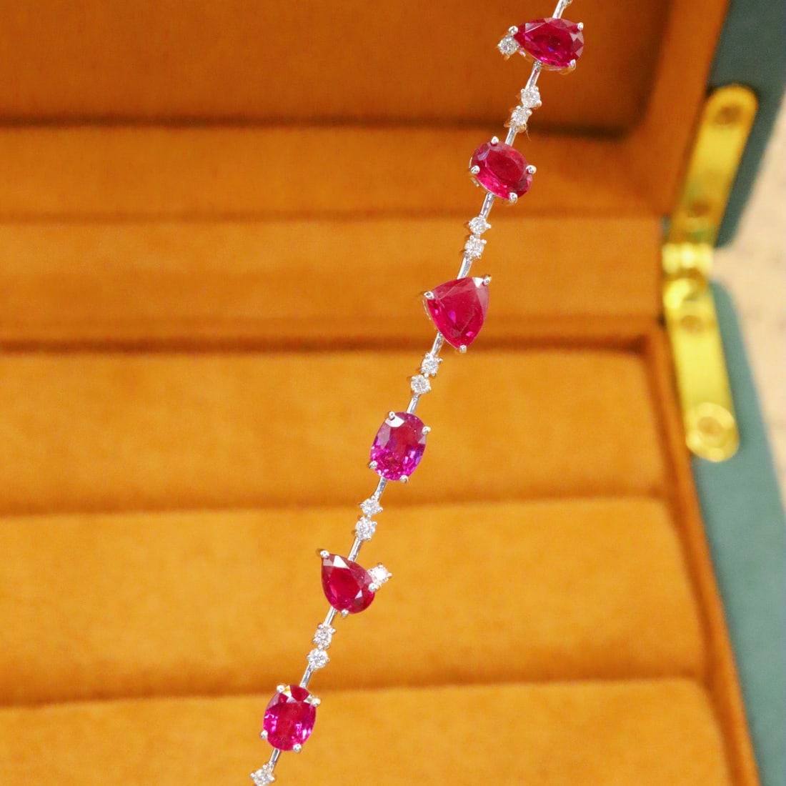 14k Gold 5.18 Ctw Natural Ruby & Diamond Bracelet: Ref:231112301 // gold content:14k gold // main gemstone:ruby // shape:multiple // carat weight:4. 80ct // color:red // treatment:natural // // adjacent gemstone 2 : diamond // number of stones:35