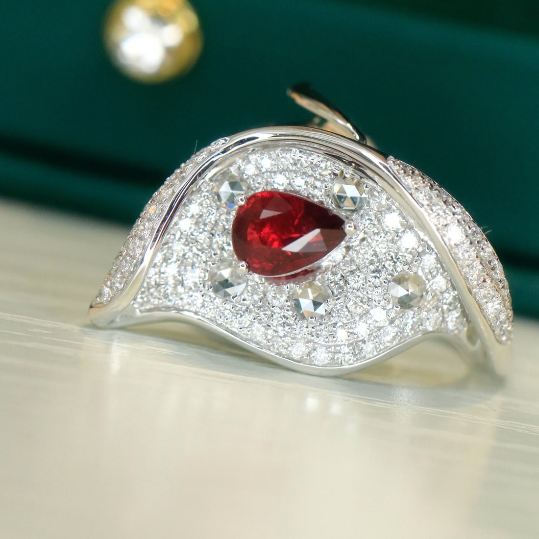 14k Gold 1.90 Ctw Natural Ruby & Diamond Ring: Ref:231112337 // gold content:14k gold // ring size:7. 25us // // main gemstone:ruby // shape:pear // carat weight:1. 02ct // color:pigeonblood red // treatment:natural // // adjacent gemstone 2 :