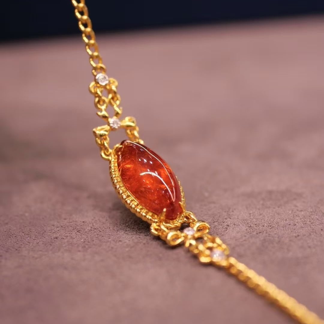 14k Gold 3.78 Ct Natural Spessartine & Diamond Bracelet: Ref:230935029 // gold content:14k gold // main gemstone:spessartine // shape:marquise // carat weight:3. 78ct // color:orange // treatment:natural // // adjacent gemstone 2 : diamond // shape:round