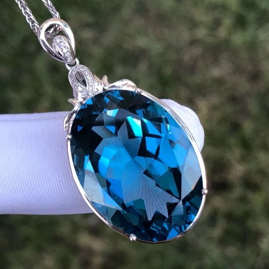 14k Gold 36.1 Ct Natural Topaz & Diamond Pendant( Without Chain ): Ref:230935054 // gold content:14k gold // main gemstone:topaz // shape:oval // carat weight:36. 1ct // color:blue // treatment:natural // // adjacent gemstone 2 : diamond // shape:round // clarity gra