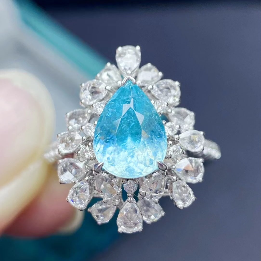 14k Gold 2.51 Ctw Natural Paraiba Tourmaline & Diamond Ring: Ref:230935062 // gold content:14k gold // ring size:7. 25us // // main gemstone:paraiba tourmaline // shape:pear // carat weight:1. 8ct // color:blue // treatment:natural // // adjacent gemstone 2
