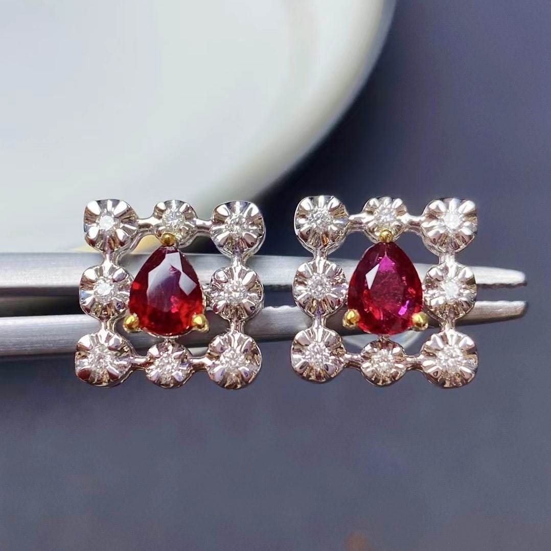 14k Gold 0.63 Ctw Natural Ruby & Diamond Earrings: Ref:230935069 // gold content:14k gold // main gemstone:ruby // shape:pear // carat weight:0. 52ct // color:red // treatment:natural // // adjacent gemstone 2 : diamond // shape:round // carat