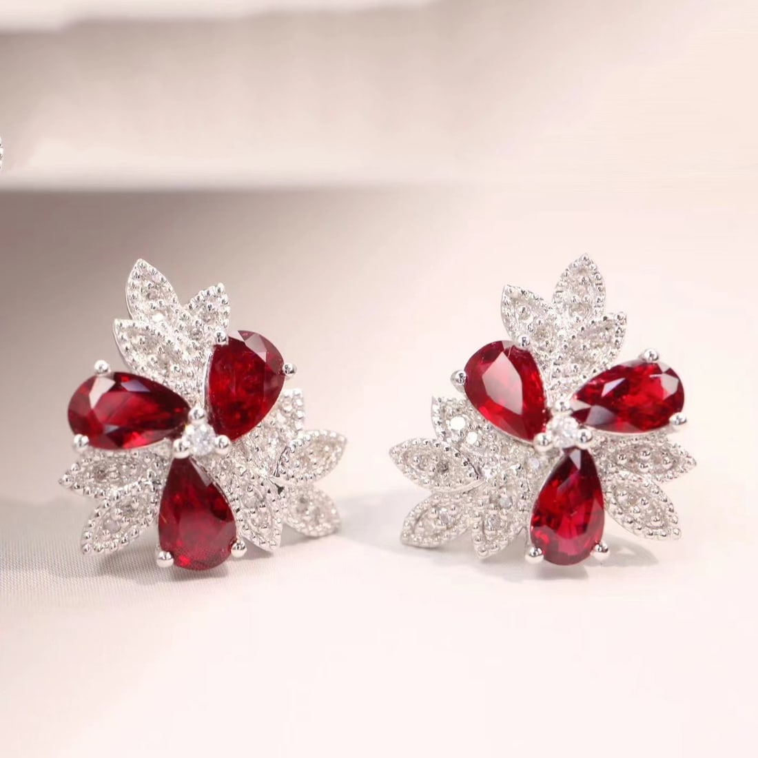 14k Gold 1.79 Ctw Natural Ruby & Diamond Earrings: Ref:230935140 // gold content:14k gold // main gemstone:ruby // shape:pear // carat weight:1. 65ct // color:pigeonblood red // treatment:natural // // adjacent gemstone 2 : diamond // shape:round // c