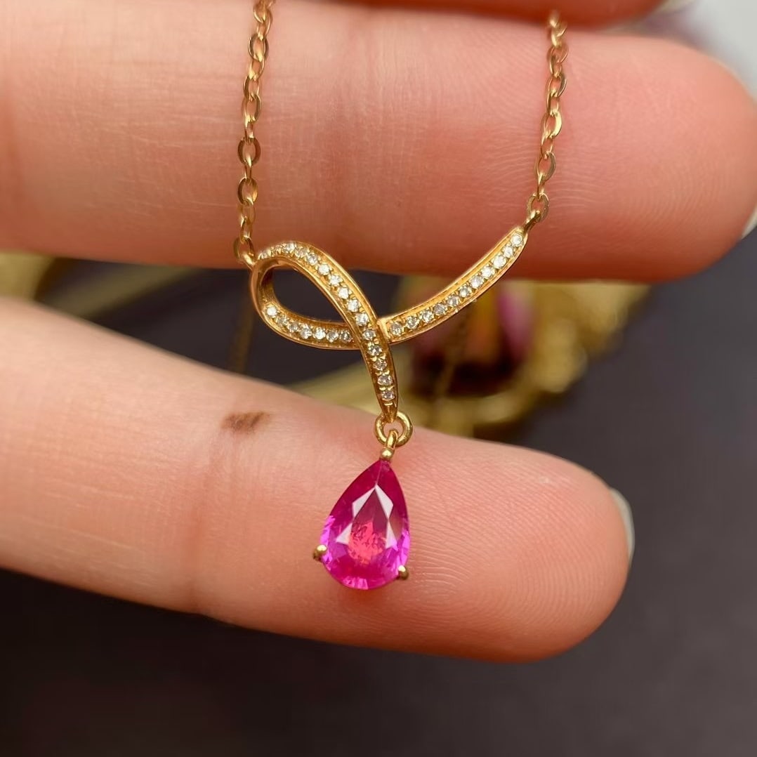 14k Gold 1 Ct Natural Ruby & Diamond Necklace: Ref:230935222 // gold content:14k gold // main gemstone:ruby // shape:pear // carat weight:1ct // color:red // treatment:natural // // adjacent gemstone 2 : diamond // number of stones:33 // shape:rou