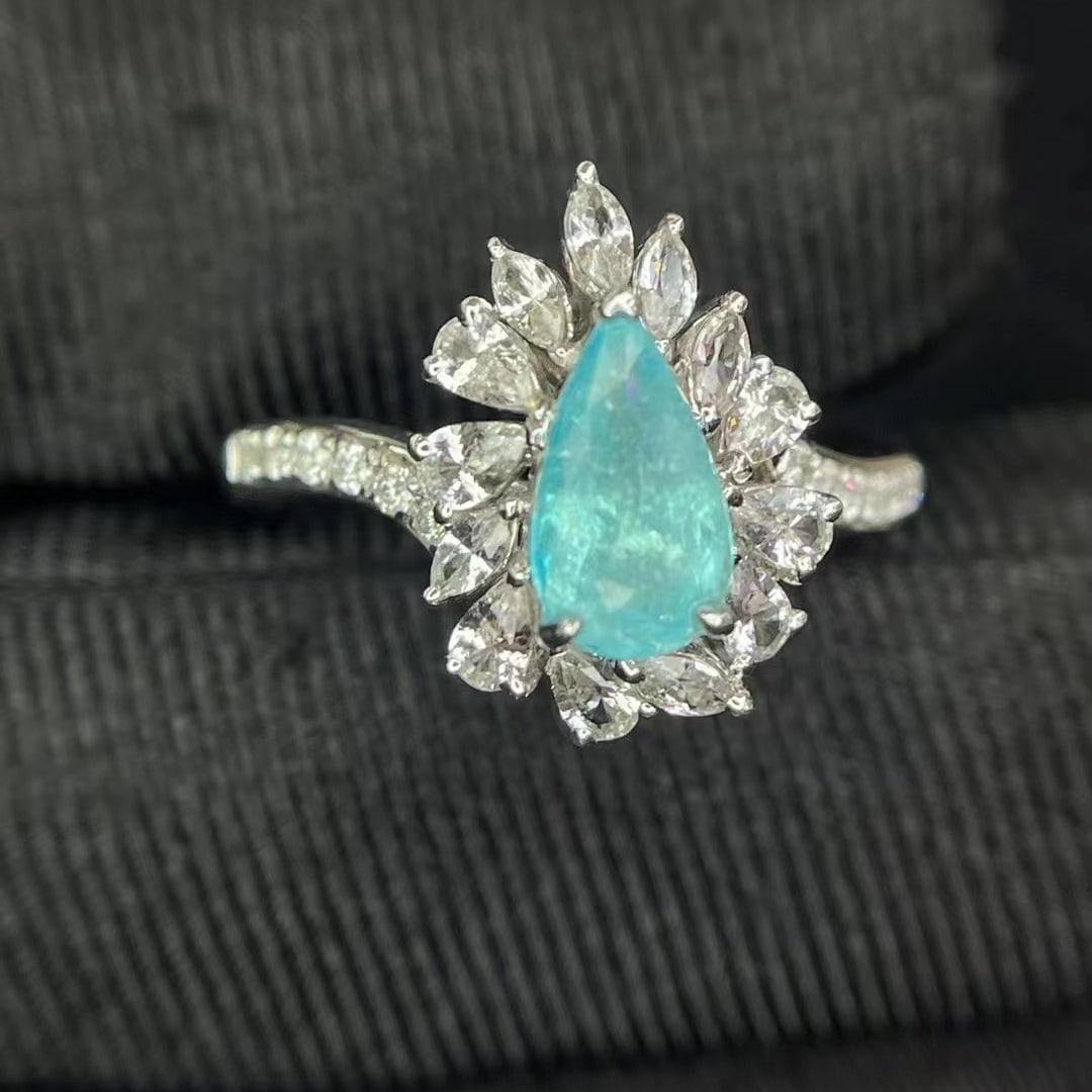 14k Gold 1.03 Ctw Natural Paraiba Tourmaline & Diamond Ring: Ref:230936046 // gold content:14k gold // ring size:7. 25us // // main gemstone:paraiba tourmaline // shape:pear // carat weight:0. 91ct // color:blue // treatment:natural // // adjacent gemstone