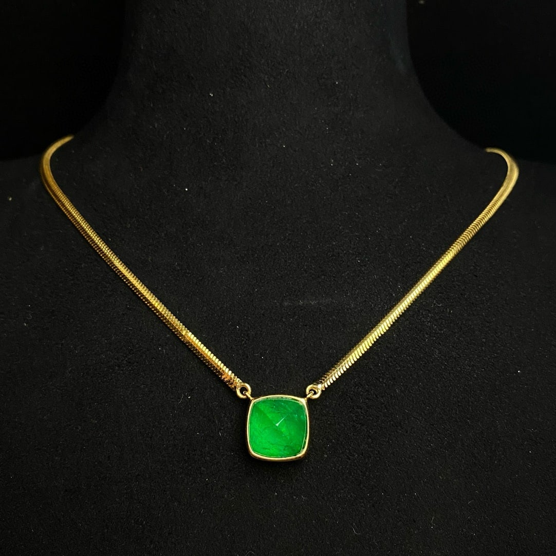 14k Gold 6.15 Ct Vivid Green Natural Emerald Necklace: Ref:230936064 // gold content:14k gold // main gemstone:emerald // shape:suger-loaf // carat weight:6. 15ct // color:vivid green // treatment:natural // Condition: NewLow Estimate: 23000.00High