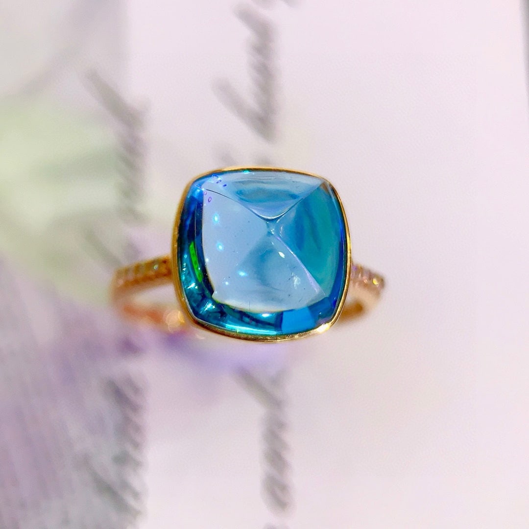 14k Gold 7.54 Ctw Natural Topaz & Diamond Ring: Ref:230936119 // gold content:14k gold // ring size:7. 25us // // main gemstone:topaz // shape:suger-loaf // carat weight:7. 5ct // color:blue // treatment:natural // // adjacent gemstone 2 :