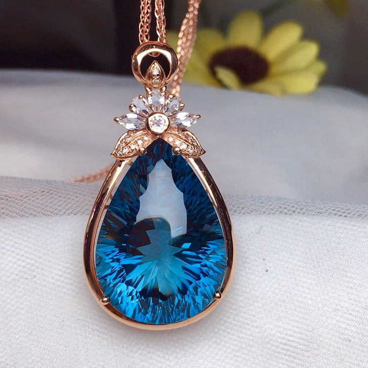 14k Gold 29.60 Ct Natural Topaz & Diamond Pendant( Without Chain ): Ref:230936172 // gold content:14k gold // main gemstone:topaz // shape:pear // carat weight:29. 60ct // color:blue // treatment:natural // // adjacent gemstone 2 : diamond // number of stones:18 //