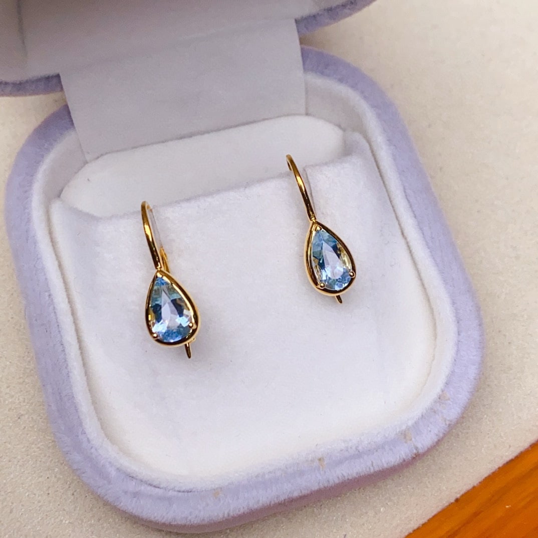 14k Gold 1.7 Ct Natural Aquamarine Earrings: Ref:230936213 // gold content:14k gold // main gemstone:aquamarine // shape:pear // carat weight:1. 7ct // color:blue // treatment:natural // Condition: New Low Estimate: 2000.00 High Estimate: 3000.
