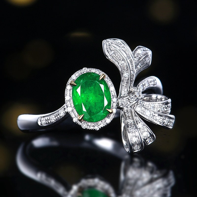 14k Gold 0.78 Ctw Vivid Green Natural Emerald & Diamond Ring: Ref:230936222 // gold content:14k gold // ring size:7. 25us // // main gemstone:emerald // shape:oval // carat weight:0. 65ct // color:vivid green // treatment:natural // // adjacent gemstone 2 : diam