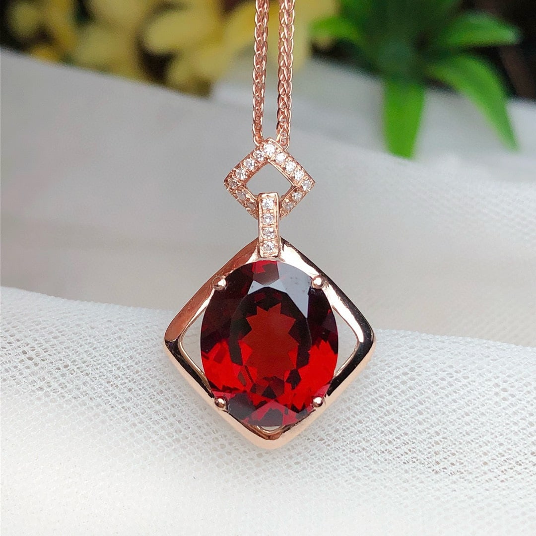14k Gold 5.20 Ct Natural Garnet & Diamond Pendant( Without Chain ): Ref:230936255 // gold content:14k gold // main gemstone:garnet // shape:oval // carat weight:5. 20ct // color:red // treatment:natural // // adjacent gemstone 2 : diamond // number of stones:17 //