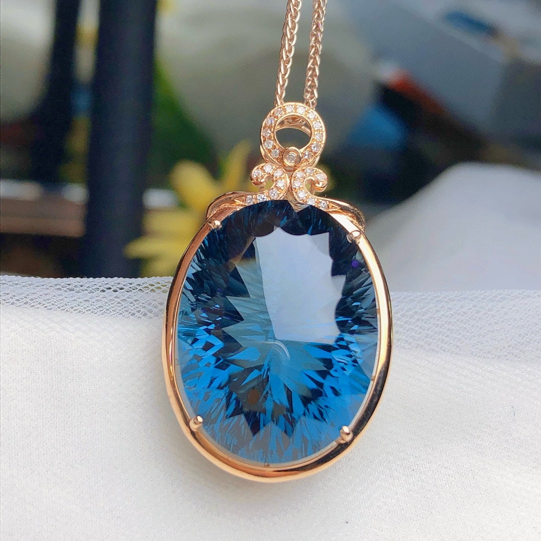 14k Gold 34.05 Ct Natural Topaz & Diamond Pendant( Without Chain ): Ref:230936266 // gold content:14k gold // main gemstone:topaz // shape:oval // carat weight:34. 05ct // color:london blue // treatment:natural // // adjacent gemstone 2 : diamond // number of stones:2