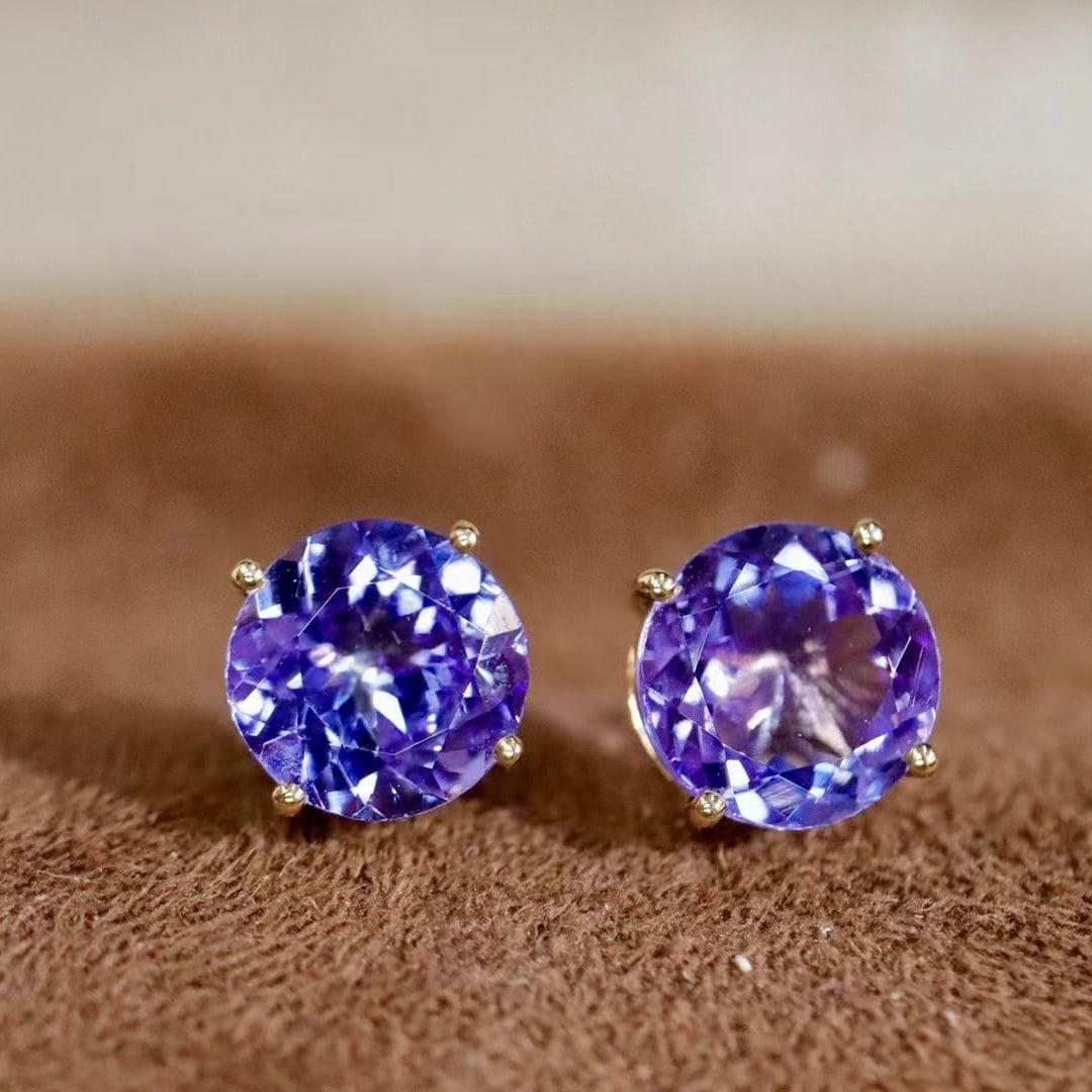 14k Gold 2.36 Ct Natural Tanzanite Earrings: Ref:230936288 // gold content:14k gold // main gemstone:tanzanite // shape:round // carat weight:2. 36ct // color:blue // treatment:natural // cut grade:g // Condition: NewLow Estimate: 1100.00High