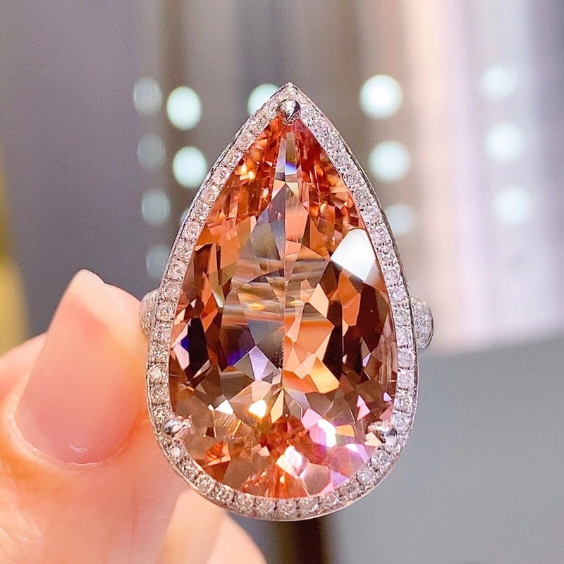 14k Gold 17.5 Ct Natural Morganite & Diamond Ring: Ref:230939019 // gold content:14k gold // ring size:7. 25us // // main gemstone:morganite // shape:pear // carat weight:17. 5ct // color:orange // treatment:natural // // adjacent gemstone 2 :