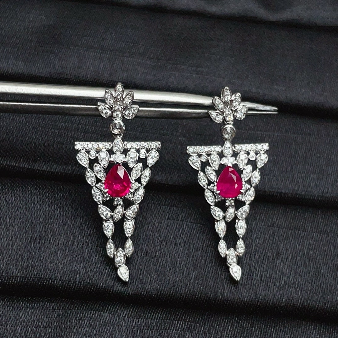 14k Gold 1.32 Ct Natural Ruby & Diamond & Sapphire Earrings: Ref:230940008 // gold content:14k gold // main gemstone:ruby // shape:pear // carat weight:1. 32ct // color:red // treatment:natural // // adjacent gemstone 2 : diamond // number of stones:146 //