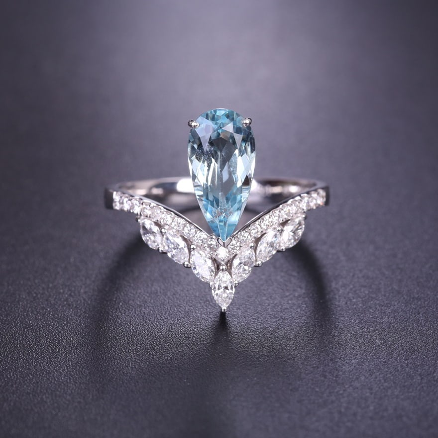14k Gold 1.86 Ctw Natural Aquamarine & Diamond Ring: Ref:230940036 // gold content:14k gold // ring size:7. 25us // // main gemstone:aquamarine // shape:pear // carat weight:1. 46ct // color:blue // treatment:natural // // adjacent gemstone 2 :