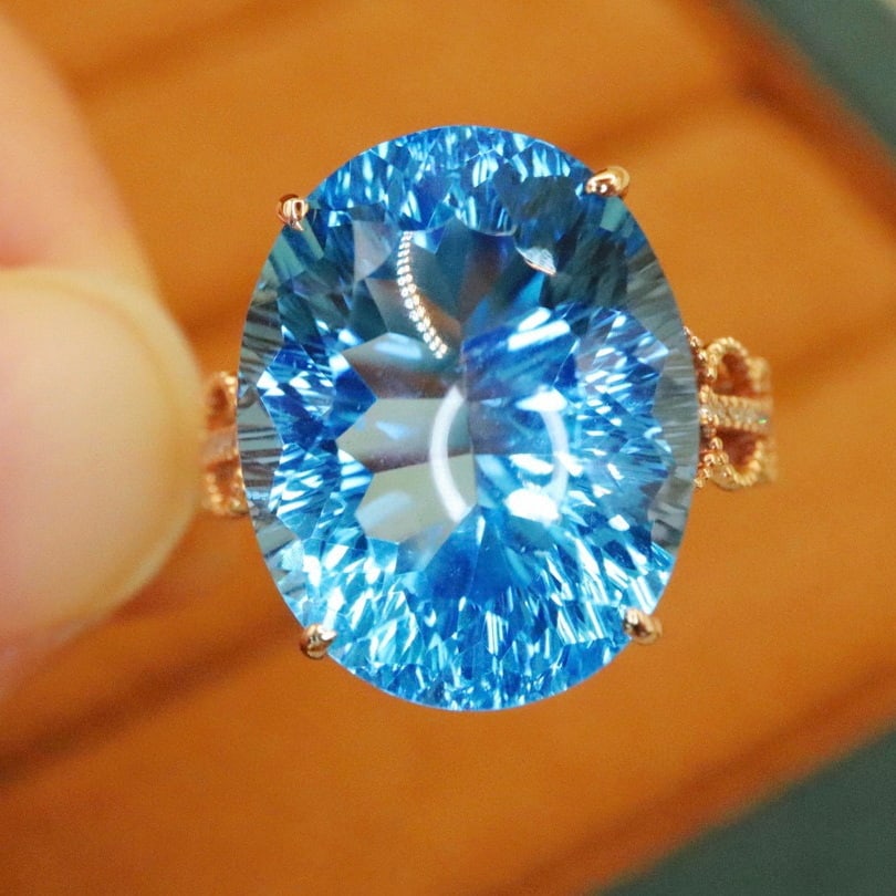 14k Gold 15.75 Ctw Natural Topaz & Diamond Ring: Ref:230940066 // gold content:14k gold // ring size:7. 25us // // main gemstone:topaz // shape:oval // carat weight:15. 68ct // color:blue // treatment:natural // // adjacent gemstone 2 : diamond