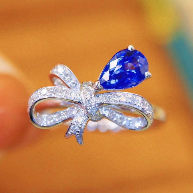 14k Gold 1.26 Ctw Natural Sapphire & Diamond Ring: Ref:230940069 // gold content:14k gold // ring size:7. 25us // // main gemstone:sapphire // shape:pear // carat weight:1. 08ct // color:royal blue // treatment:natural // // adjacent gemstone 2 :