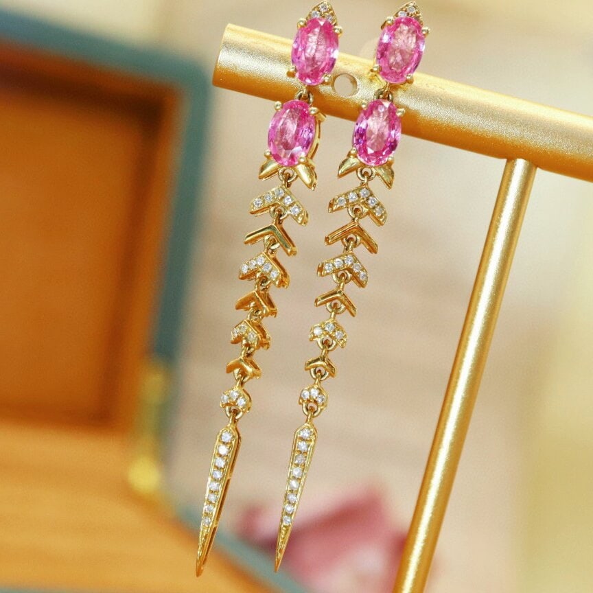 14k Gold 2.26 Ctw Natural Padparadscha Sapphire & Diamond Earrings: Ref:230940108 // gold content:14k gold // main gemstone:padparadscha sapphire // shape:oval // carat weight:2. 08ct // color:orangish pink // treatment:natural // // adjacent gemstone 2 : diamond