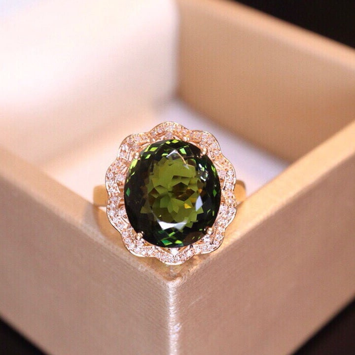 14k Gold 8.84 Ct Natural Tourmaline & Diamond Ring: Ref:230940141 // gold content:14k gold // ring size:7. 25us // // main gemstone:tourmaline // shape:oval // carat weight:8. 84ct // color:green // treatment:natural // // adjacent gemstone 2 : diamond