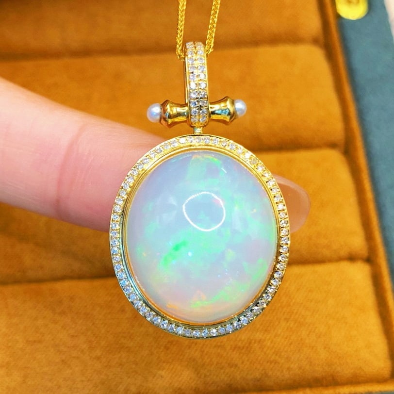 14k Gold 15.72 Ctw Natural Opal & Diamond Pendant( Without Chain ): Ref:230940289 // gold content:14k gold // main gemstone:opal // shape:oval // carat weight:15. 45ct // color:white // treatment:natural // // adjacent gemstone 2 : diamond // number of stones:90 //