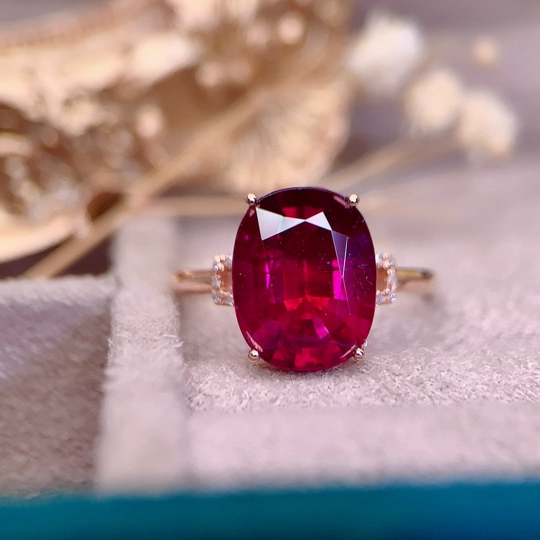 14k Gold 5.3 Ct Natural Tourmaline & Diamond Ring: Ref:230941075 // gold content:14k gold // ring size:7. 25us // // main gemstone:tourmaline // shape:oval // carat weight:5. 3ct // color:red // treatment:natural // // adjacent gemstone 2 :