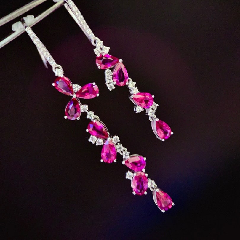 14k Gold 3.28 Ctw Natural Ruby & Sapphire Earrings: Ref:230941130 // gold content:14k gold // main gemstone:ruby // shape:pear // carat weight:3ct // color:red // treatment:natural // // adjacent gemstone 2 : sapphire // shape:round // carat weight:0.