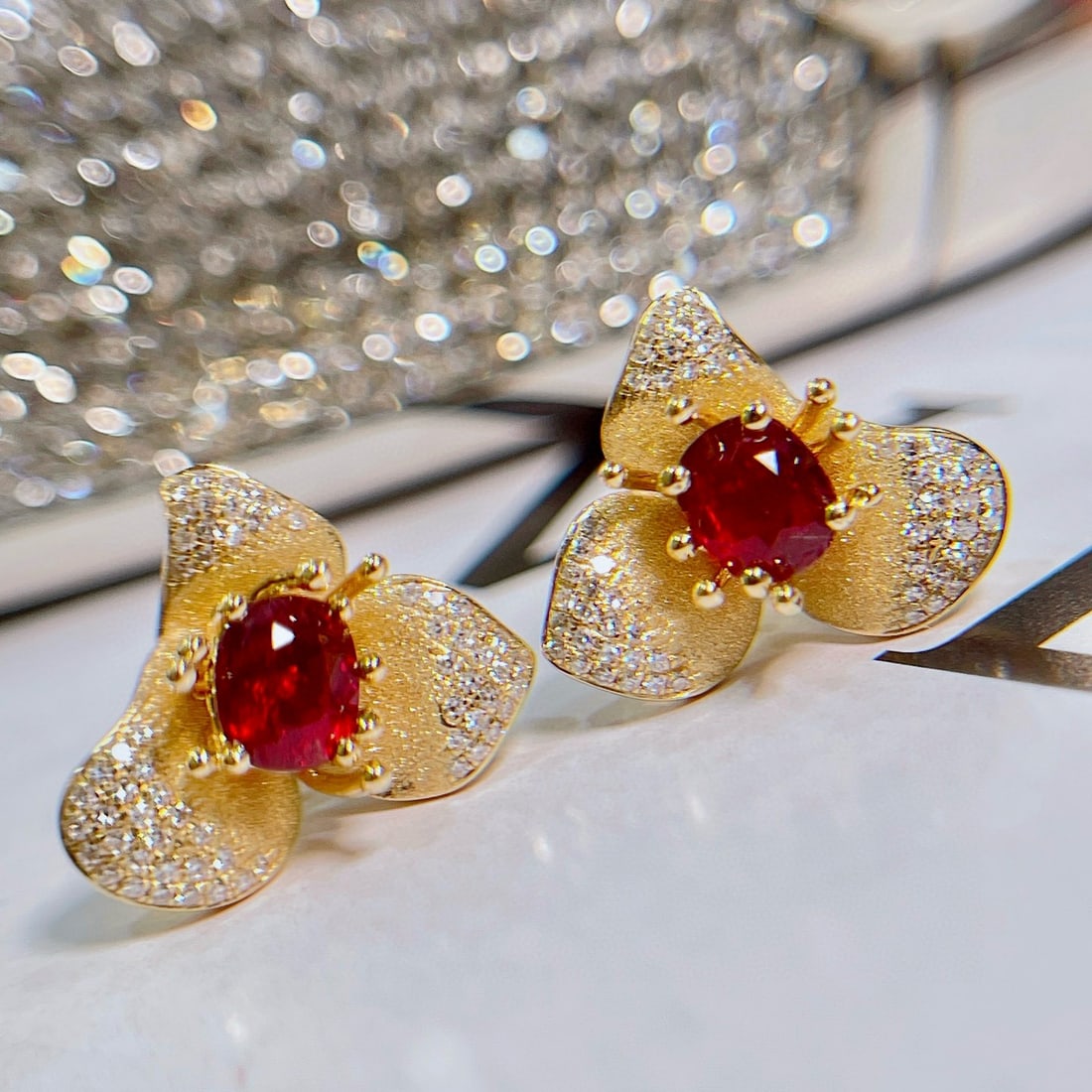 14k Gold 1.5 Ctw Natural Ruby & Diamond & Flowers Earrings: Ref:230941161 // gold content:14k gold // main gemstone:ruby // shape:cushion // carat weight:1. 2ct // color:pigeonblood red // treatment:natural // // adjacent gemstone 2 : diamond // shape:round