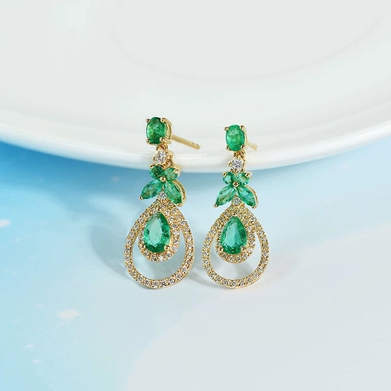 14k Gold 1.91 Ctw Natural Emerald & Diamond Earrings: Ref:230942012 // gold content:14k gold // main gemstone:emerald // shape:multiply // carat weight:1. 46ct // color:green // treatment:natural // // adjacent gemstone 2 : diamond // shape:round //