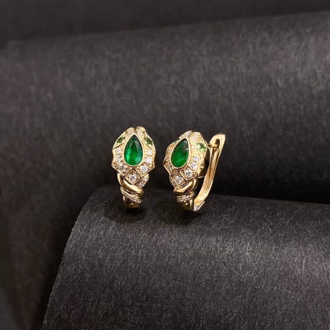 14k Gold 0.54 Ctw Vivid Green Natural Emerald & Diamond Earrings: Ref:230942073 // gold content:14k gold // main gemstone:emerald // shape:pear // carat weight:0. 36ct // color:vivid green // treatment:natural // // adjacent gemstone 2 : diamond // shape:round //