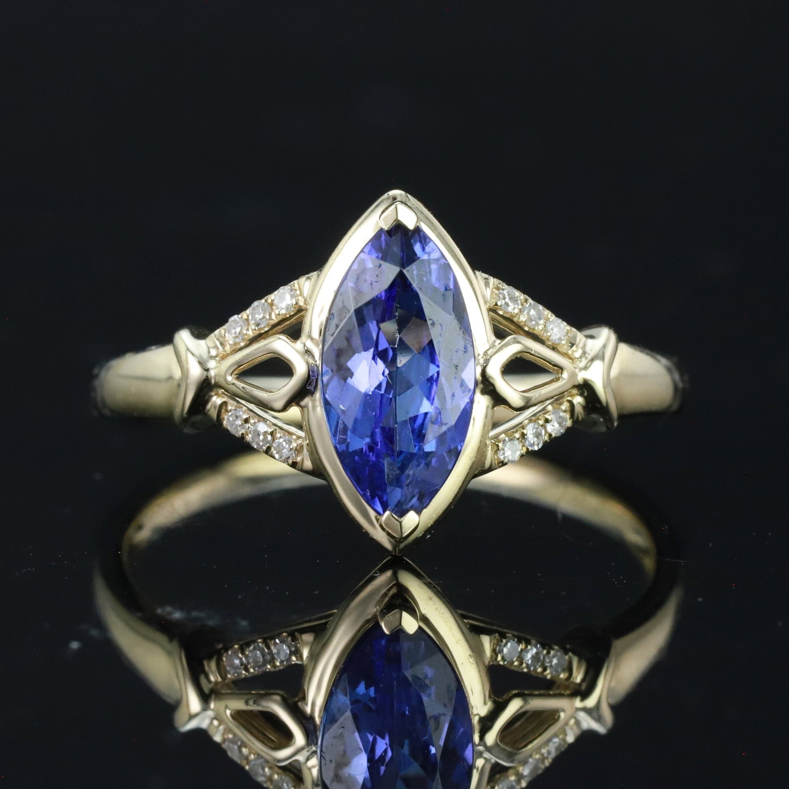 14k Gold 1.19 Ctw Natural Tanzanite & Diamond Ring: Ref:230943215 // gold content:14k gold // ring size:7. 25us // // main gemstone:tanzanite // shape:marquise // carat weight:1. 15ct // color:blue // treatment:natural // // adjacent gemstone 2 :