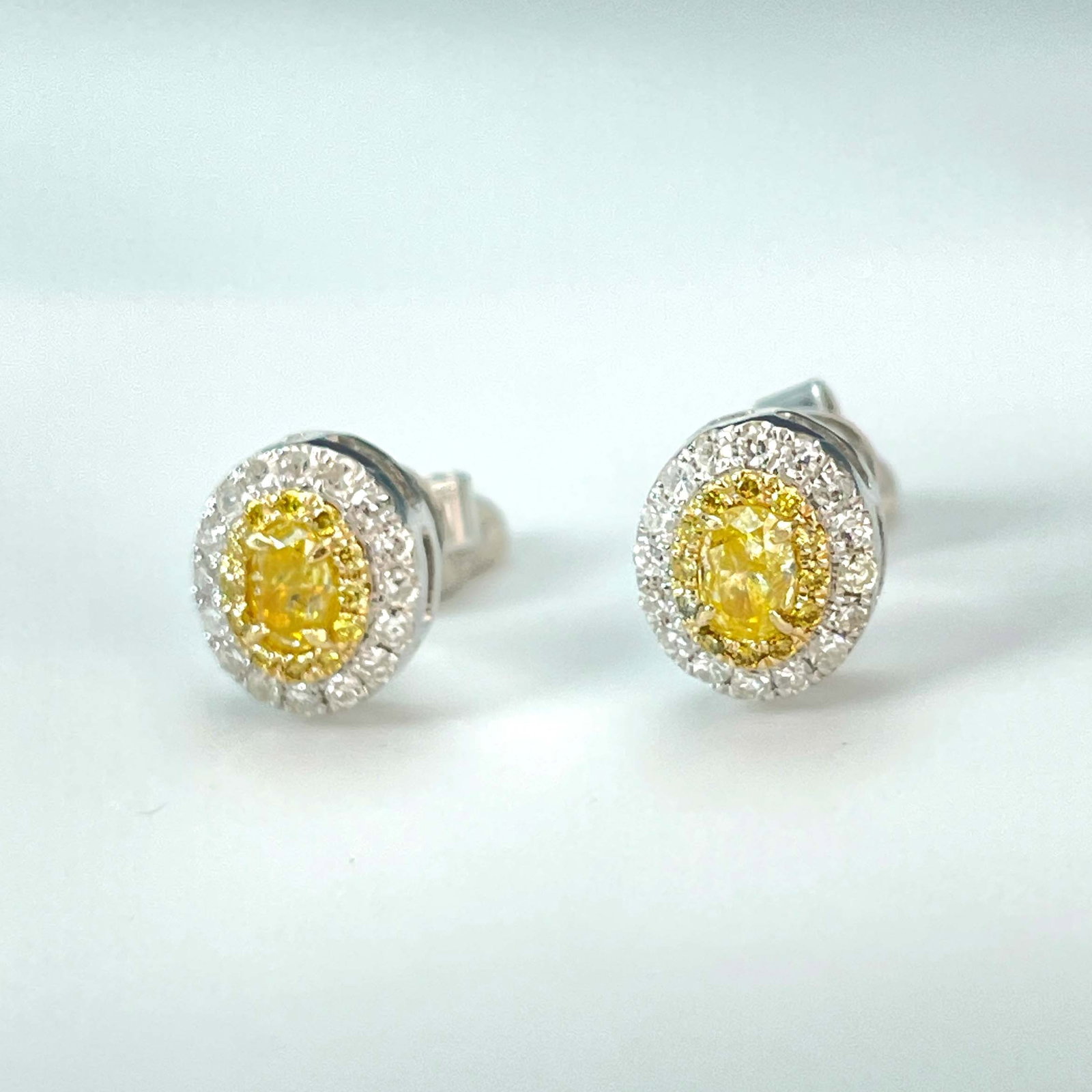 14k Gold 0.72 Ctw Natural Yellow Diamond & Diamond Earrings: Ref:230943236 // gold content:14k gold // main gemstone:yellow diamond // shape:oval // carat weight:0. 39ct // color:yellow // treatment:natural // // adjacent gemstone 2 : diamond // shape:round //