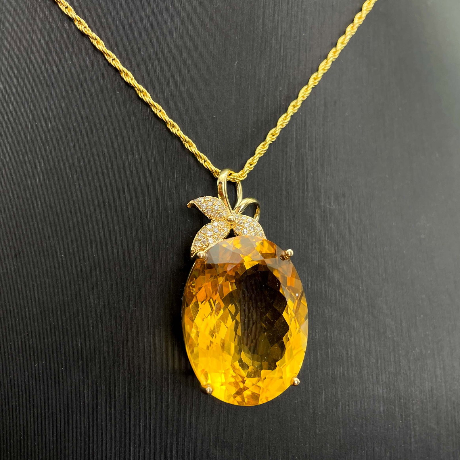 14k Gold 22.91 Ctw Natural Citrine & Diamond Pendant( Without Chain ): Ref:230943256 // gold content:14k gold // main gemstone:citrine // shape:oval // carat weight:22. 8ct // color:yellow // treatment:natural // // adjacent gemstone 2 : diamond // number of stones:34 //