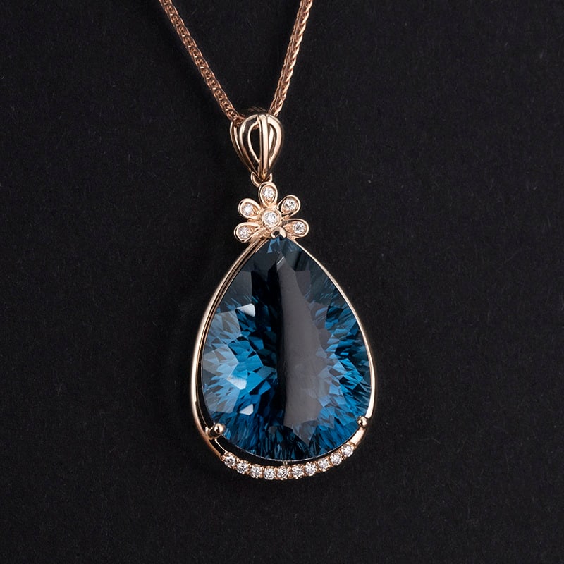 14k Gold 17.65 Ct Natural Topaz & Diamond Pendant( Without Chain ): Ref:230943437 // gold content:14k gold // main gemstone:topaz // shape:pear // carat weight:17. 65ct // color:blue // treatment:natural // // adjacent gemstone 2 : diamond // number of stones:16 //