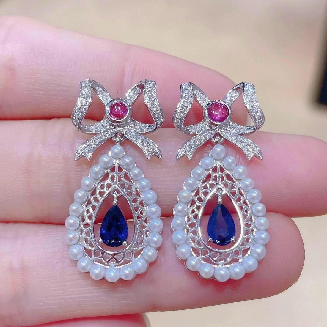 14k Gold 1.20 Ctw Natural Sapphire & Diamond Earrings: Ref:230944228 // gold content:14k gold // main gemstone:sapphire // shape:pear // carat weight:0. 94ct // color:royal blue // treatment:natural // // adjacent gemstone 2 : diamond // shape:round //