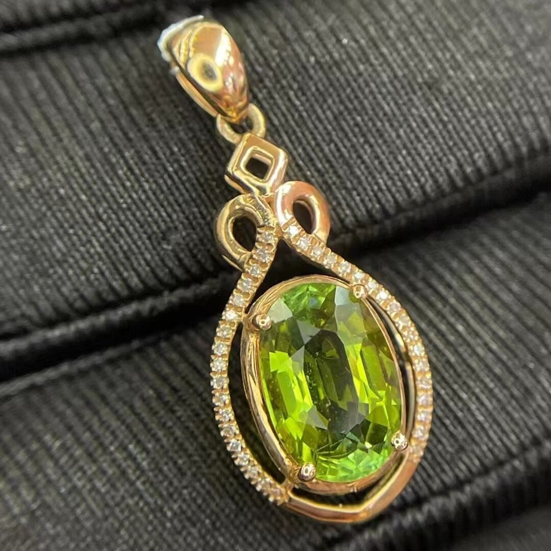 14k Gold 2.70 Ct Natural Tourmaline & Diamond Pendant( Without Chain ): Ref:230944424 // gold content:14k gold // main gemstone:tourmaline // shape:oval // carat weight:2. 70ct // color:green // treatment:natural // // adjacent gemstone 2 : diamond // number of