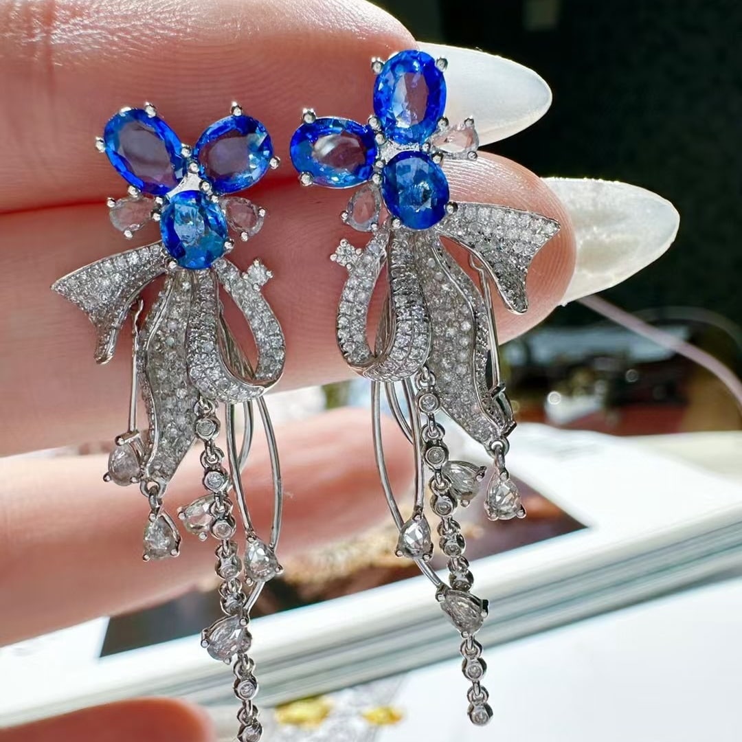 14k Gold 2.65 Ct Natural Sapphire & Diamond Earrings: Ref:230945018 // gold content:14k gold // main gemstone:sapphire // shape:oval // carat weight:2. 65ct // color:blue // treatment:natural // // adjacent gemstone 2 : diamond // number of stones:322