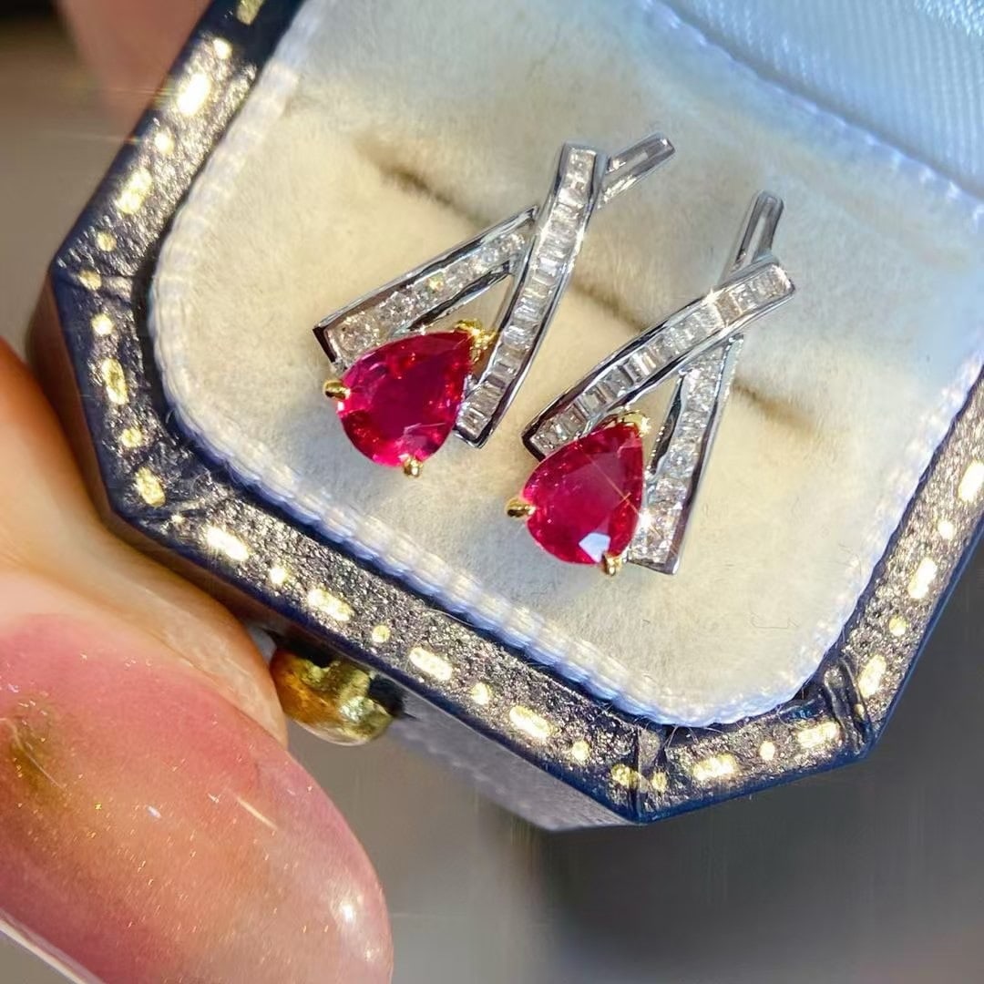 14k Gold 0.85 Ctw Natural Ruby & Diamond Earrings: Ref:230945117 // gold content:14k gold // main gemstone:ruby // shape:pear // carat weight:0. 65ct // color:red // treatment:natural // // adjacent gemstone 2 : diamond // shape:multiply // carat